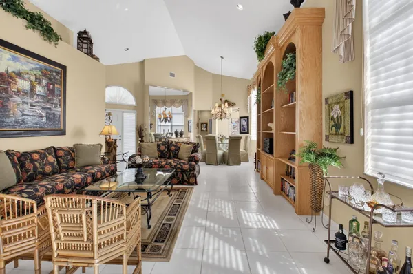 a dining room with furniture and chandelier