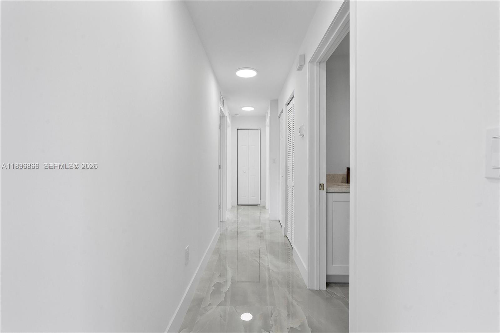 2926 Northwest 58th Street, Unit 2926 Miami, FL 33142 - Photo 12 of 28 a view of a hallway