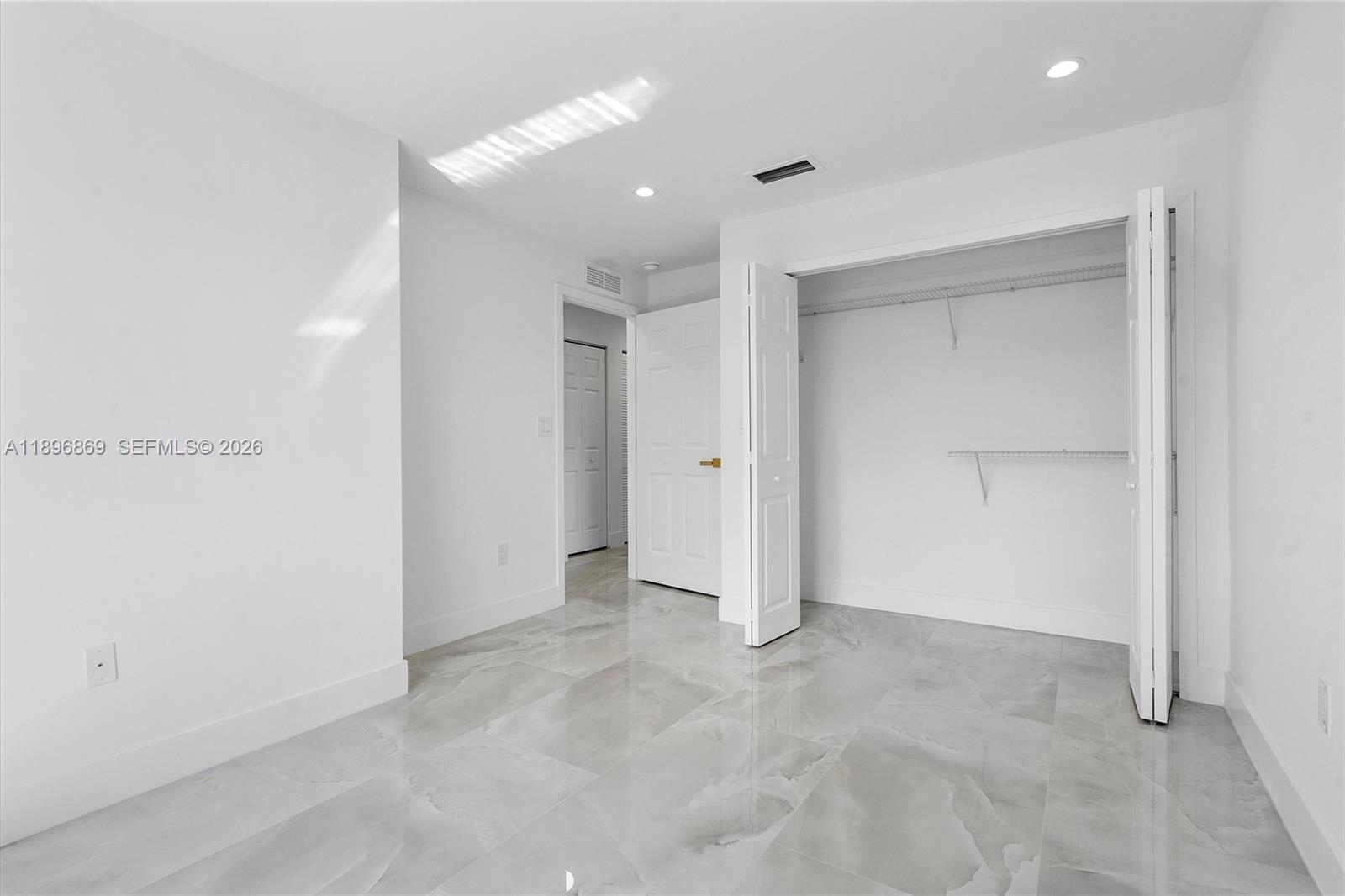 2926 Northwest 58th Street, Unit 2926 Miami, FL 33142 - Photo 16 of 28 a view of an empty room