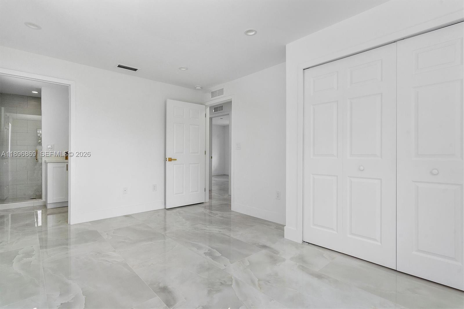 2926 Northwest 58th Street, Unit 2926 Miami, FL 33142 - Photo 17 of 28 a view of an empty room