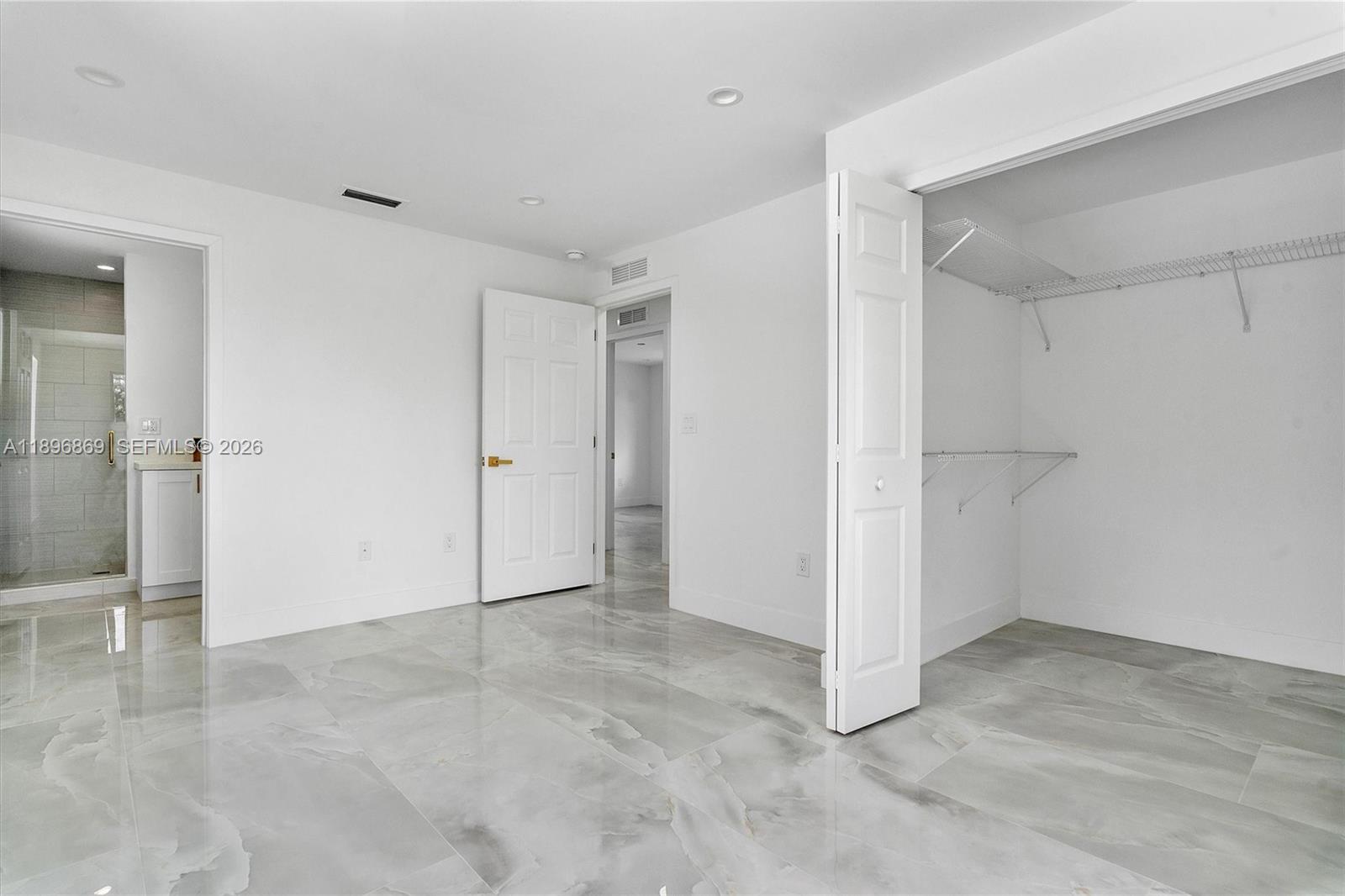 2926 Northwest 58th Street, Unit 2926 Miami, FL 33142 - Photo 18 of 28 a view of an empty room