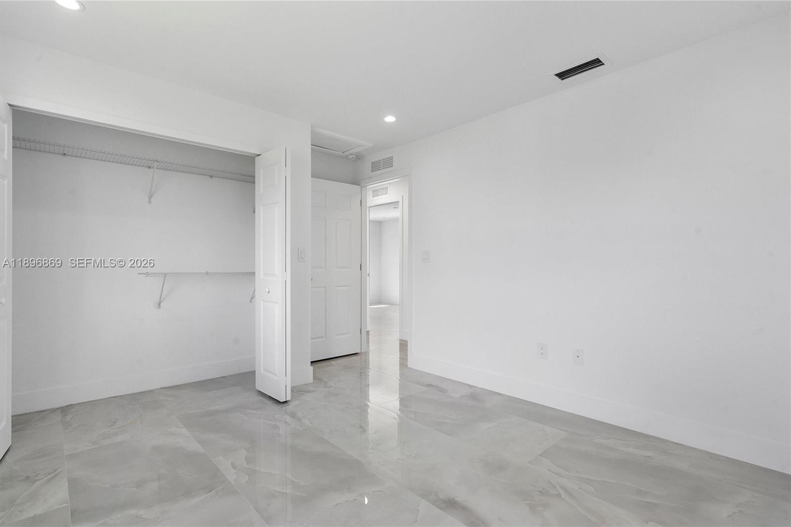 2926 Northwest 58th Street, Unit 2926 Miami, FL 33142 - Photo 22 of 28 a view of an empty room