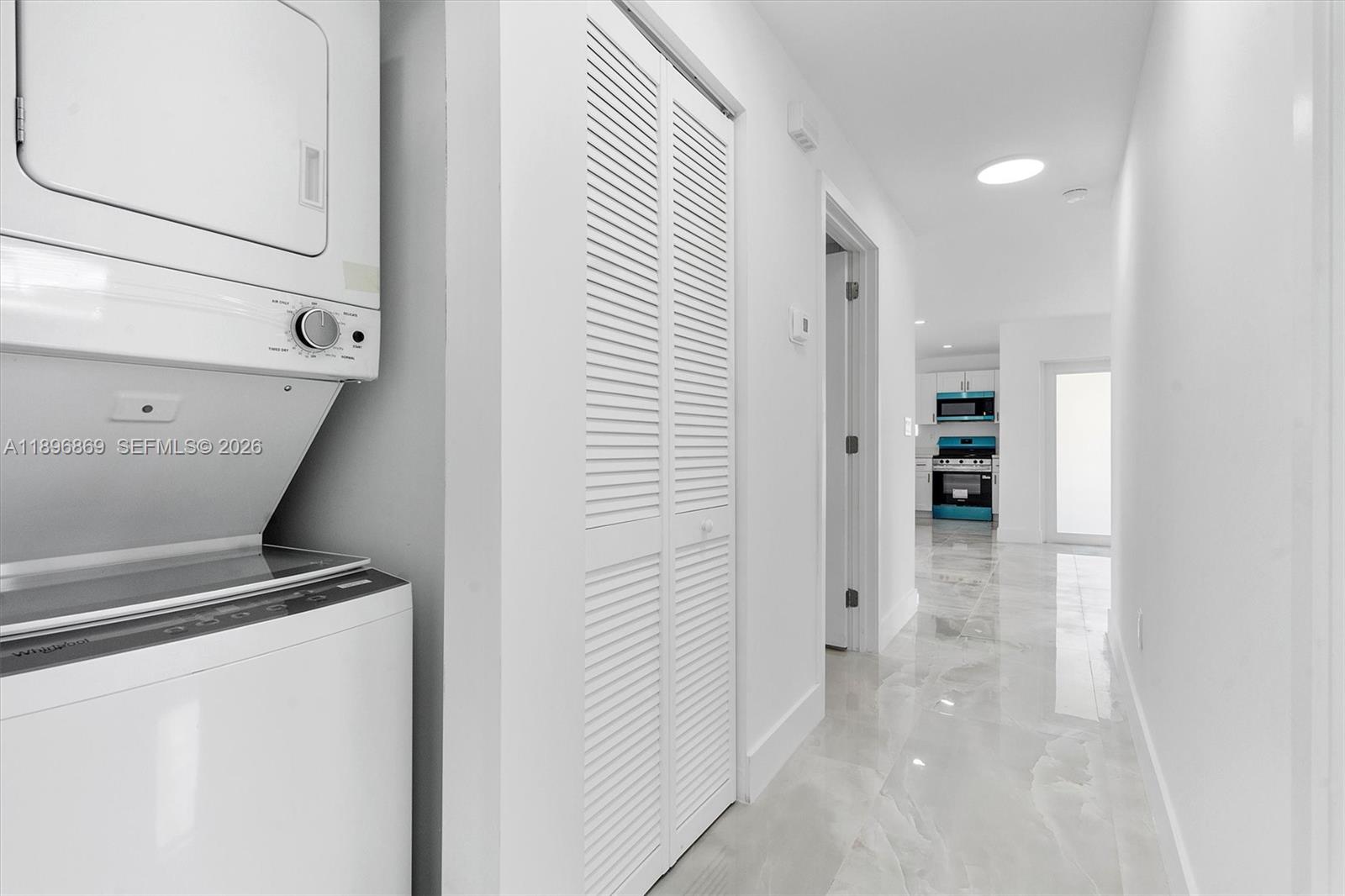 2926 Northwest 58th Street, Unit 2926 Miami, FL 33142 - Photo 23 of 28 a view of hallway with an empty room