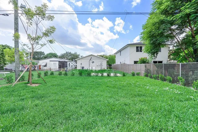 a view of backyard with garden and plants
