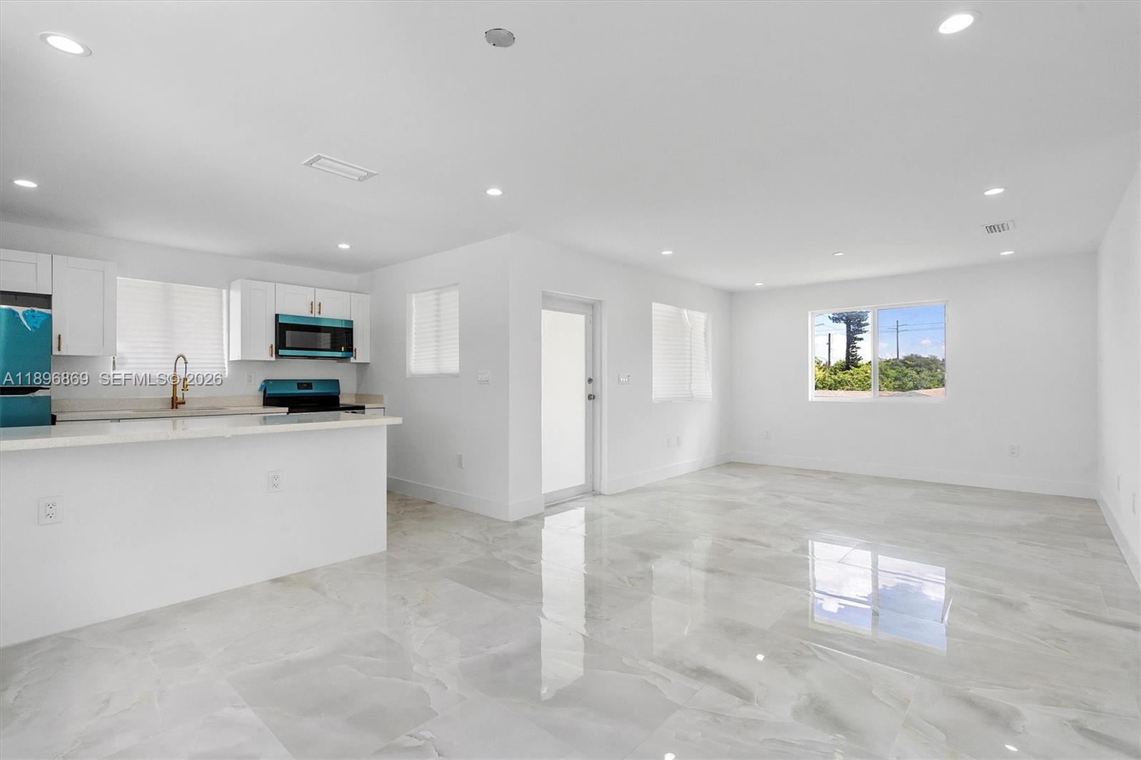 2926 Northwest 58th Street, Unit 2926 Miami, FL 33142 - Photo 6 of 28 a view of a kitchen with electric appliances