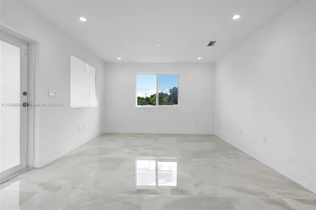 an empty room with windows