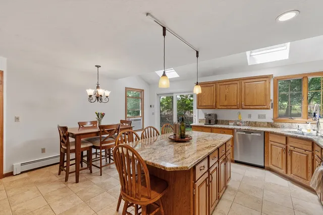 a kitchen with a table and chairs in it