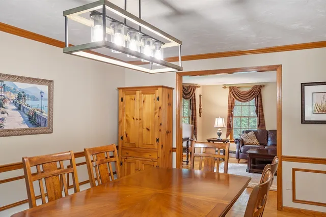 a living room with lots of furniture and a chandelier