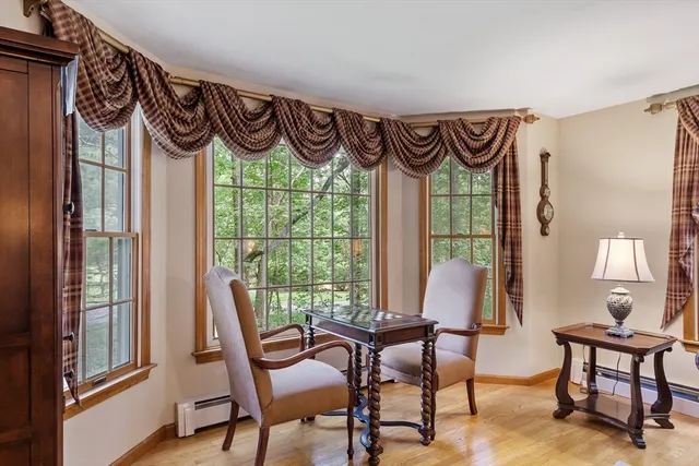 a view of a room with furniture and a window