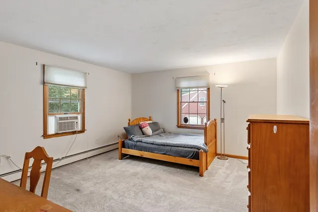 a bedroom with furniture and window