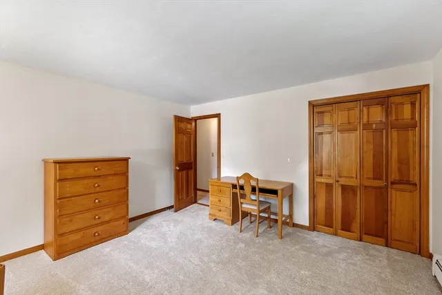 a view of room with furniture and a closet