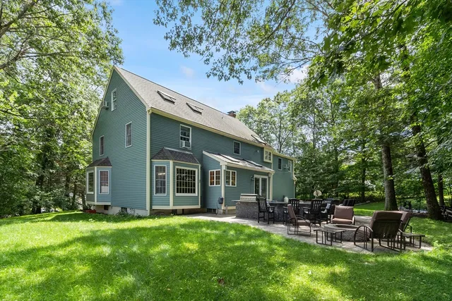 a view of an house with backyard space and garden