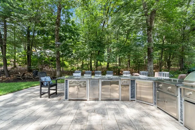 a view of a kitchen with a dining table and chairs