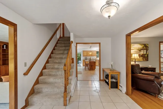 a view of a livingroom with furniture and stairs