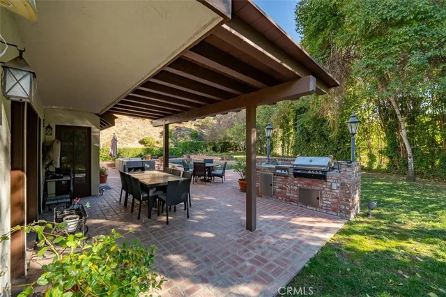 a bedroom with a bed a table and chair