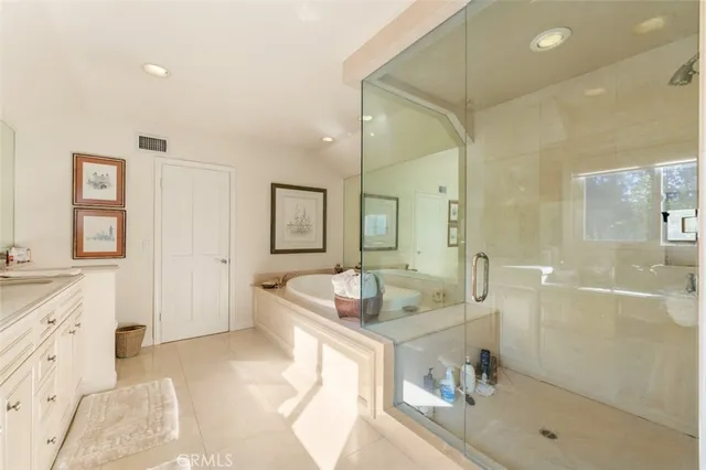 a view of a dining room with furniture wooden floor and chandelier