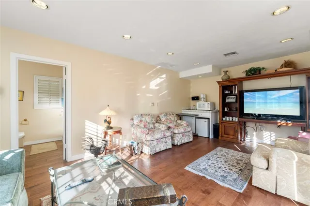 an aerial view of mountain with residential house and trees around