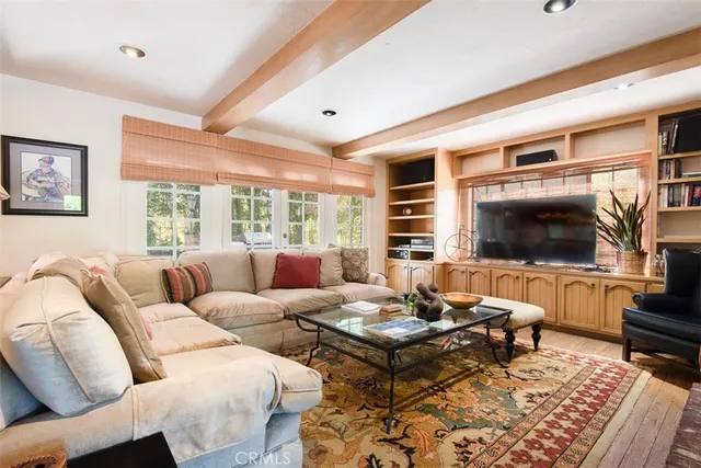 a kitchen with granite countertop white cabinets stainless steel appliances and a counter space