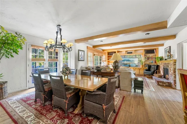 a kitchen with kitchen island granite countertop stainless steel appliances a sink stove refrigerator and cabinets