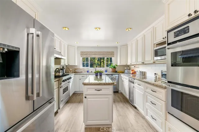a living room with furniture and a book shelf