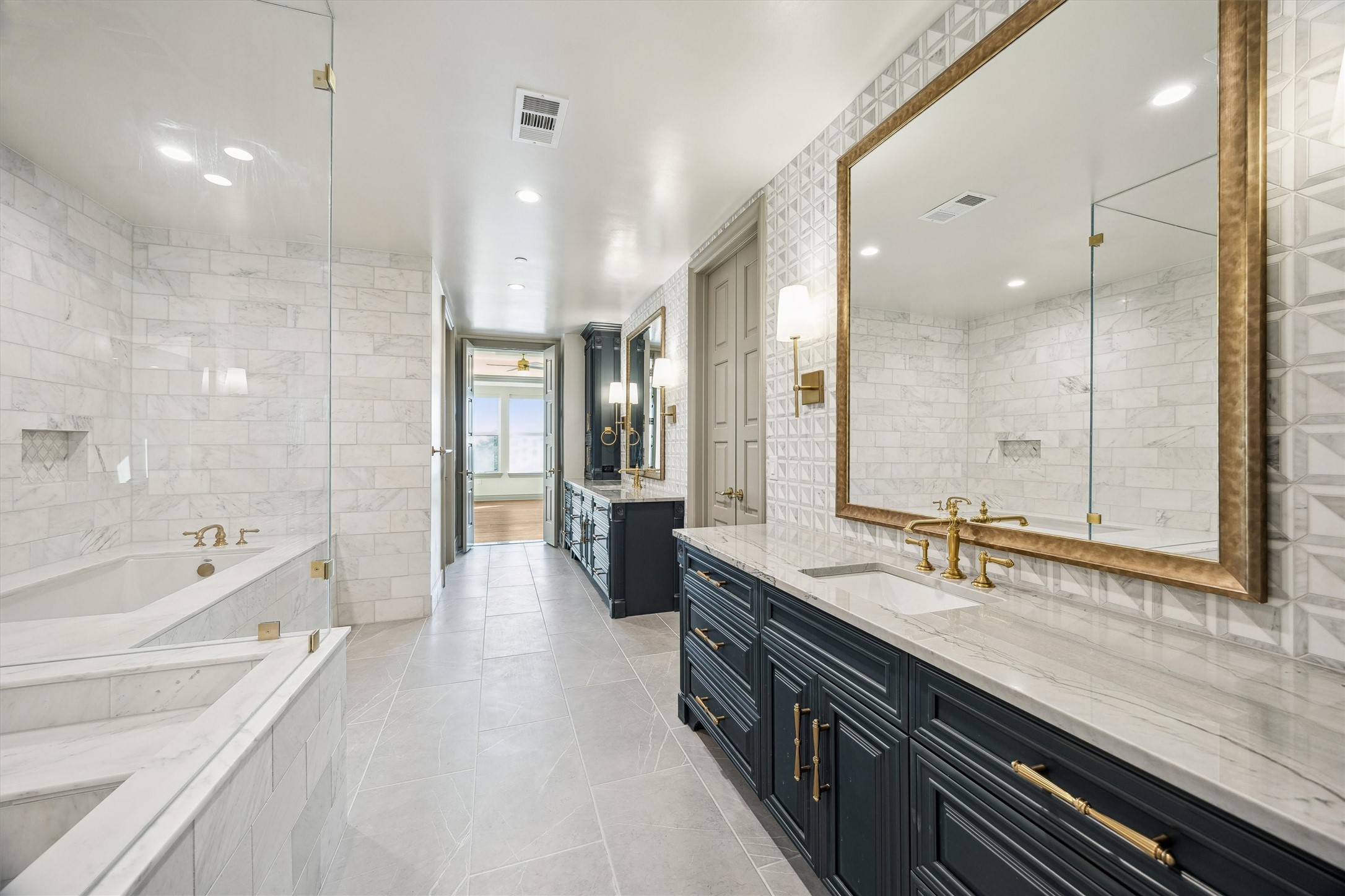 1717 Bissonnet Street, Unit 1802 Houston, TX 77005 - Photo 17 of 46 Luxurious primary bathroom with separate vanities.