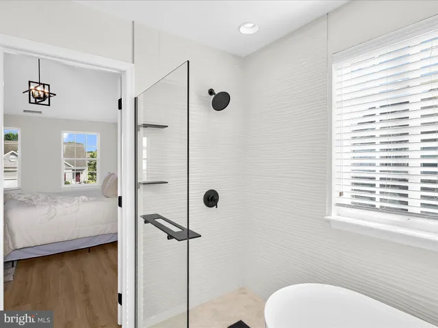 a bathroom with a toilet a sink and shower