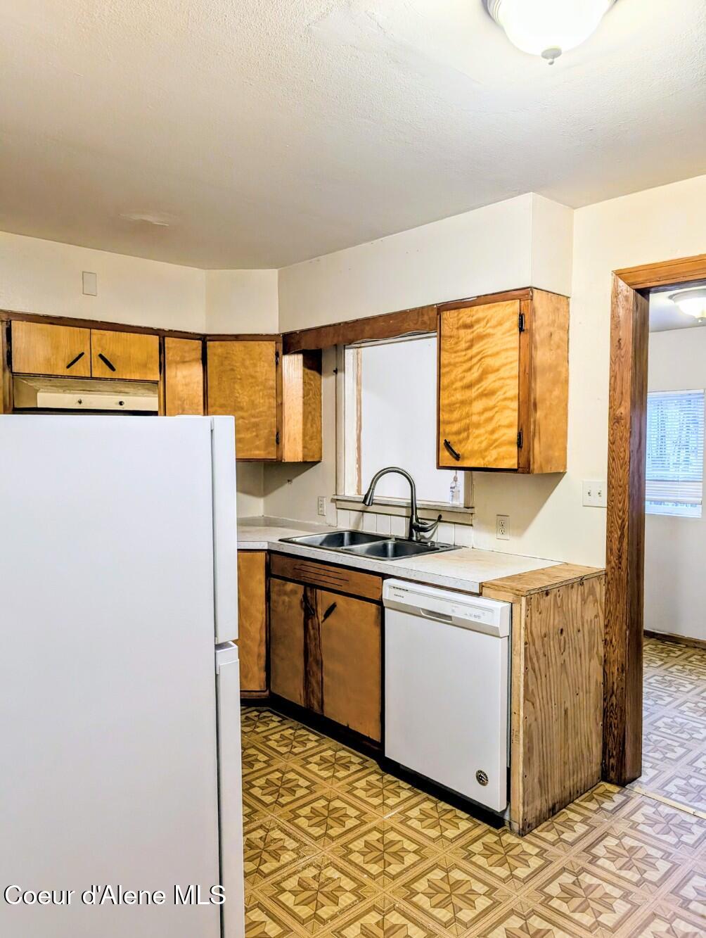 6873 Hill Side Alley Bonners Ferry, ID 83805 - Photo 8 of 27 Kitchen off of living room area