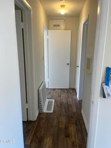 a view of bathroom with a sink and a mirror