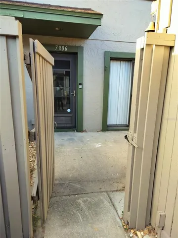 a view of a hallway with wooden walls and stairs