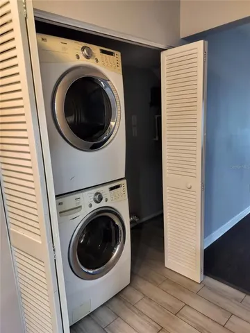 a view of a hallway with washer and dryer