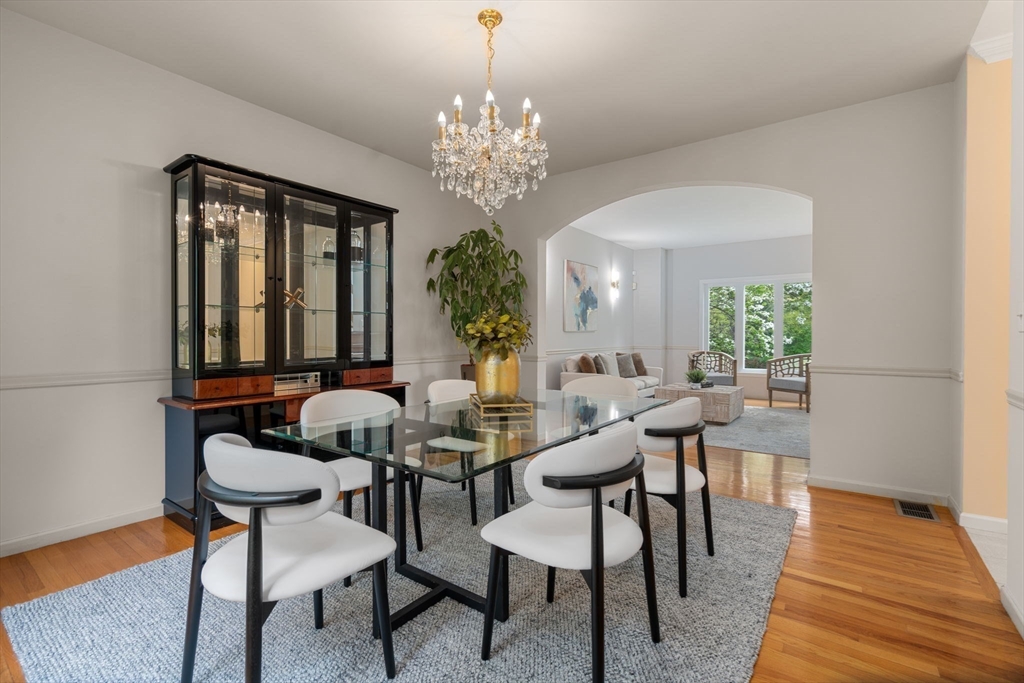 11 Black Elk Road Sharon, MA 02067 - Photo 6 of 28 a view of a dining room with furniture and a chandelier