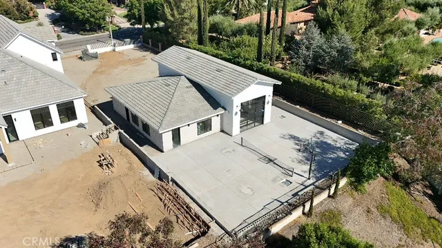 an aerial view of house with yard