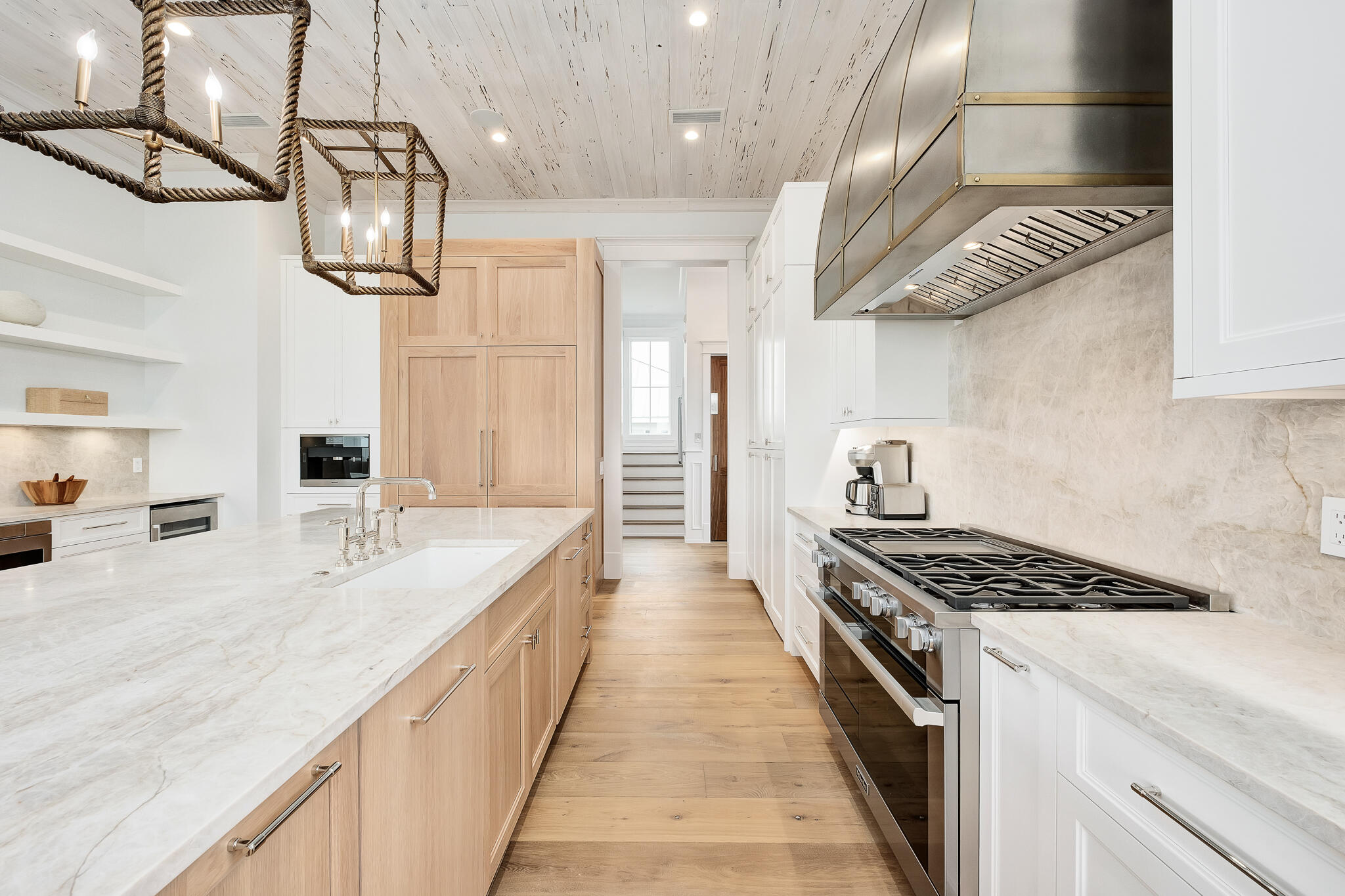 24 Brenda Ln Inlet Beach Inlet Beach, FL 32461 - Photo 23 of 55 a kitchen with stainless steel appliances granite countertop a stove a sink dishwasher and white cabinets with wooden floor