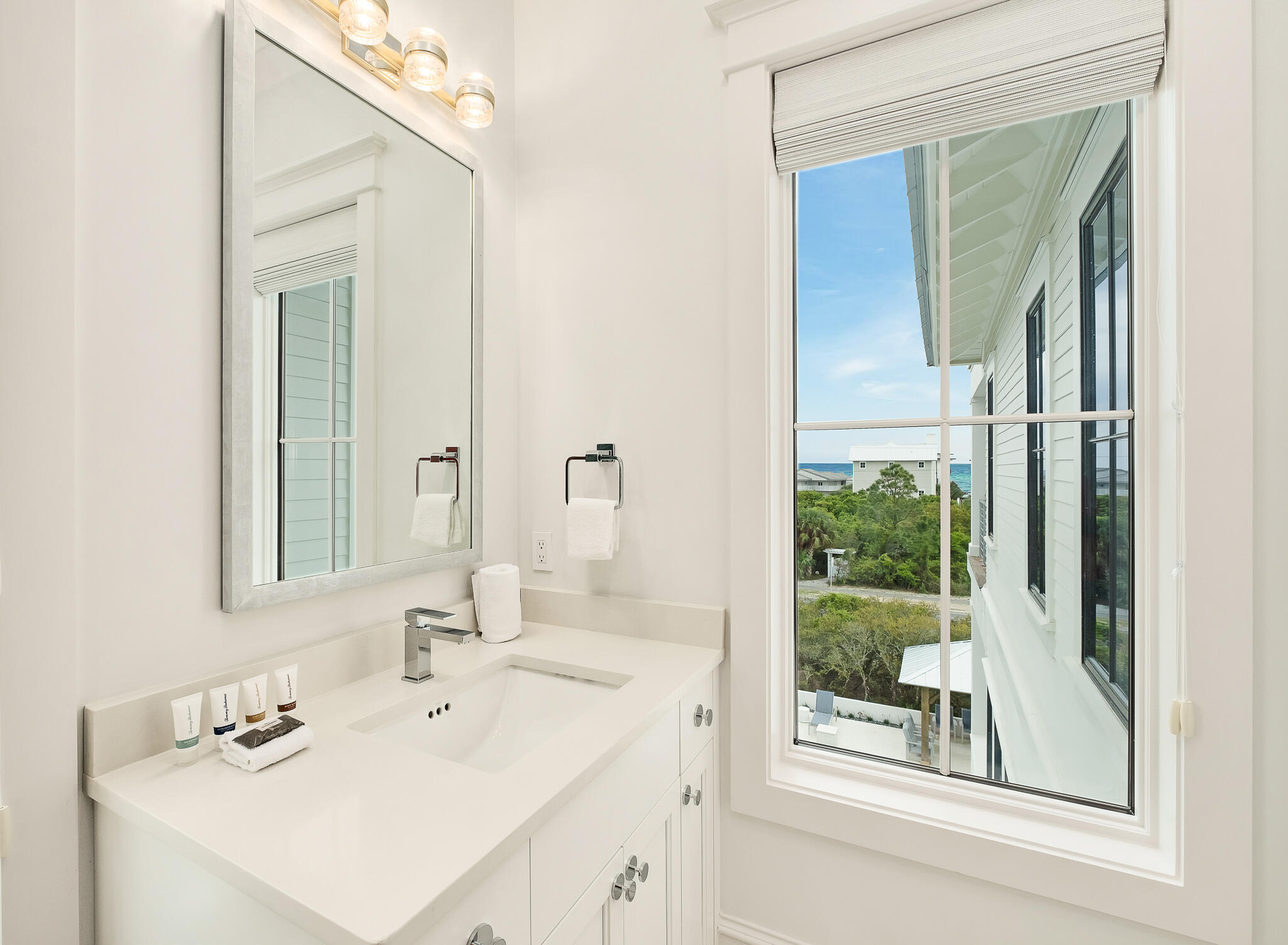 24 Brenda Ln Inlet Beach Inlet Beach, FL 32461 - Photo 35 of 55 a bathroom with a sink and a mirror