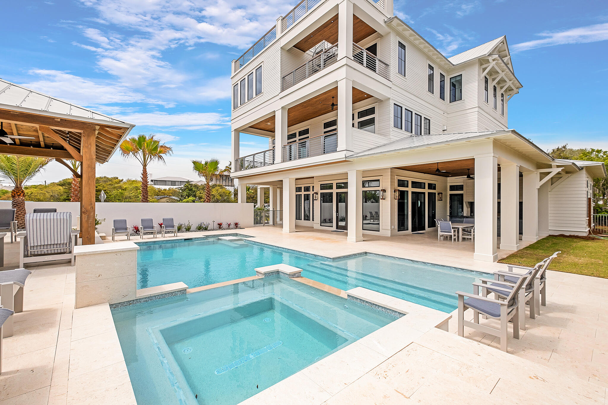 24 Brenda Ln Inlet Beach Inlet Beach, FL 32461 - Photo 4 of 55 a view of a house with pool lawn chairs and a barbeque