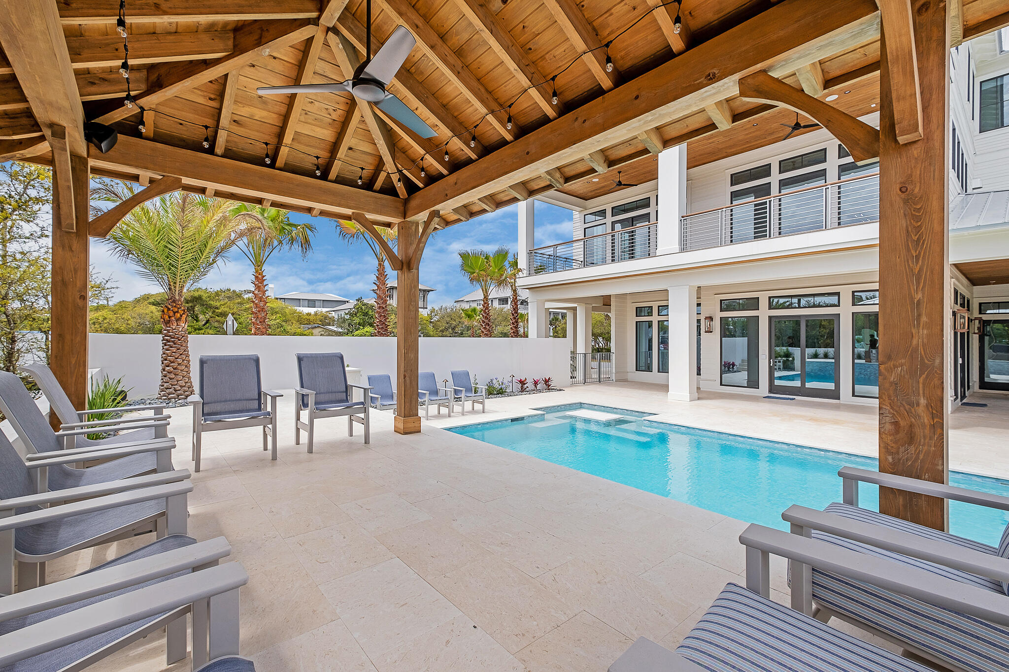 24 Brenda Ln Inlet Beach Inlet Beach, FL 32461 - Photo 46 of 55 a view of a patio with couches table and chairs and potted plants