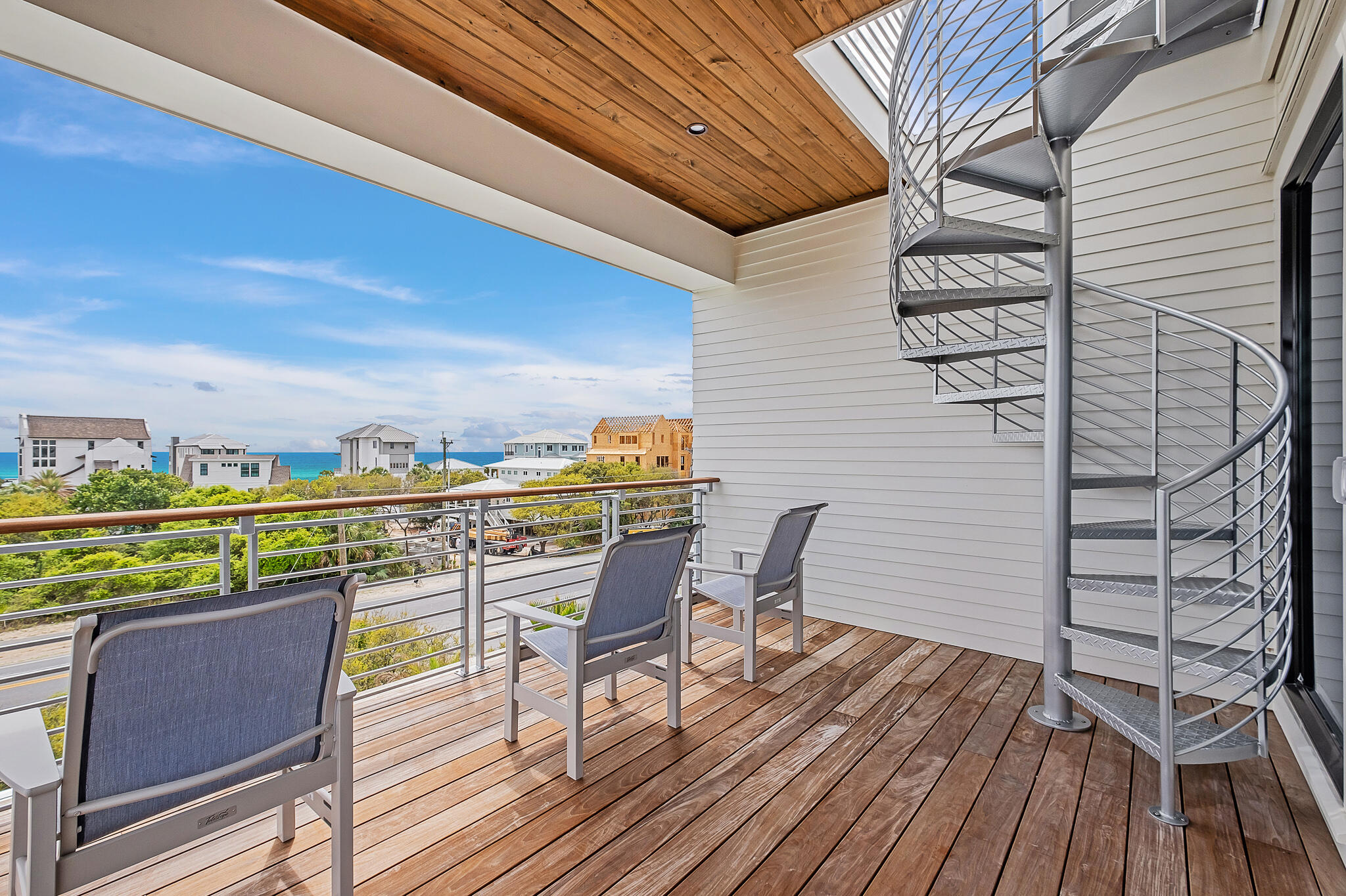 24 Brenda Ln Inlet Beach Inlet Beach, FL 32461 - Photo 51 of 55 a view of a balcony with furniture and wooden floor