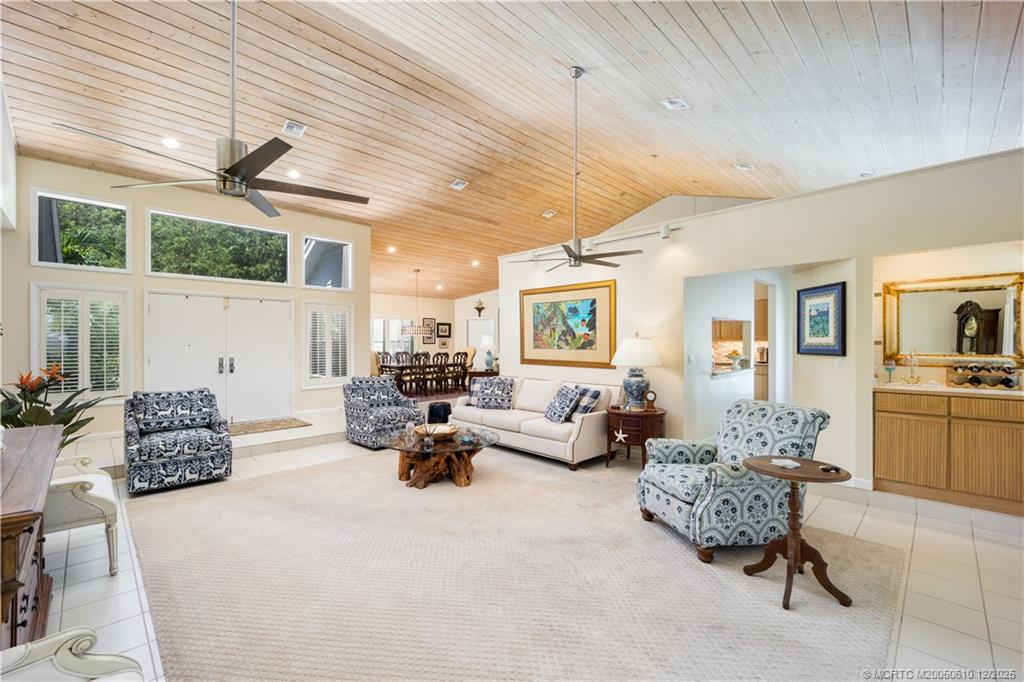 8 Kingston Court Stuart, FL 34996 - Photo 13 of 51 a living room with furniture and a large window
