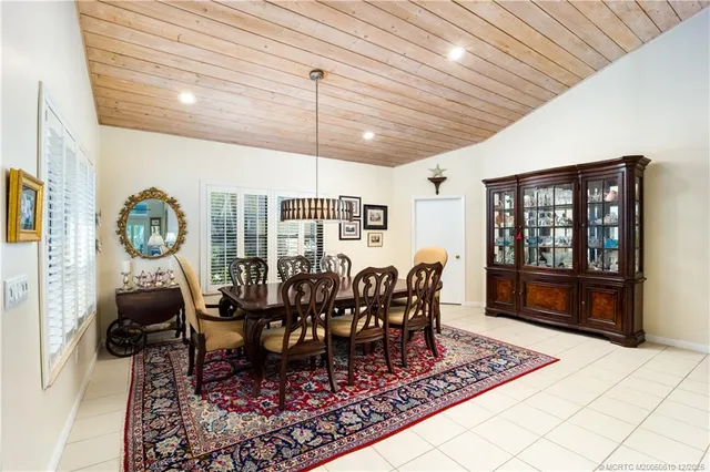 a kitchen with stainless steel appliances granite countertop a stove and a white cabinets