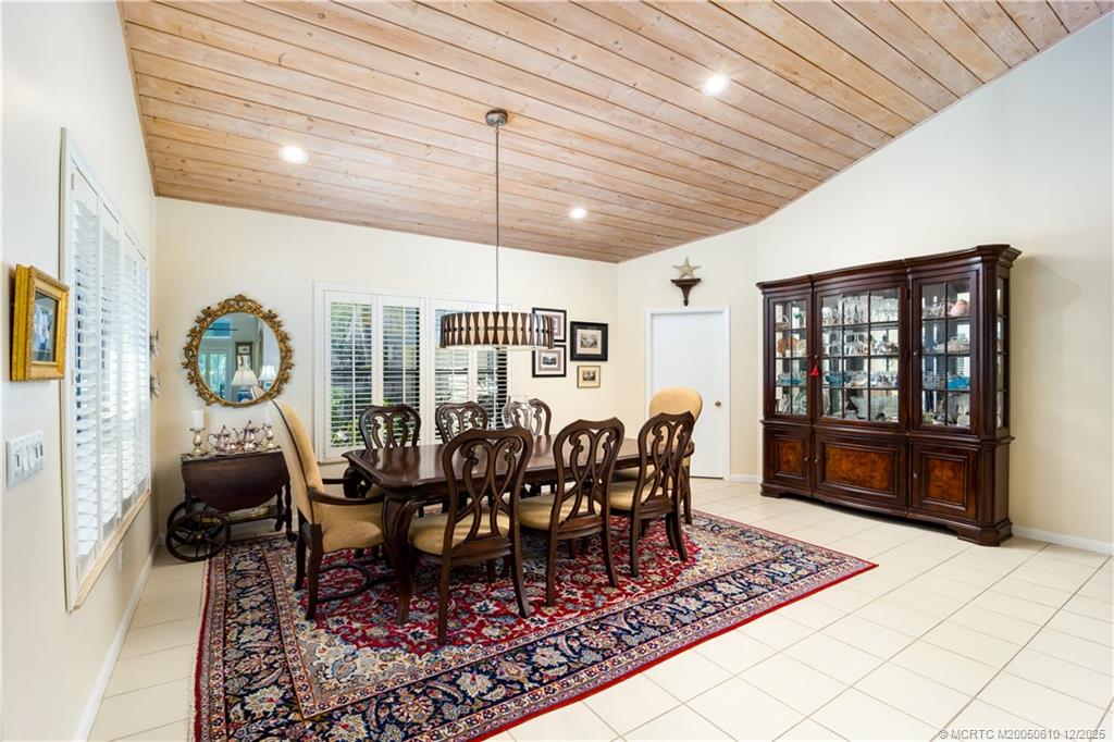 8 Kingston Court Stuart, FL 34996 - Photo 16 of 51 a view of a dining room with furniture window and wooden floor