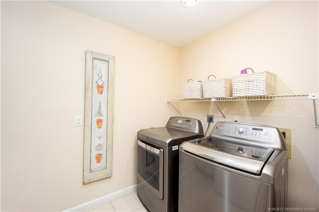 8 Kingston Court Stuart, FL 34996 - Photo 27 of 51 a utility room with dryer and washer