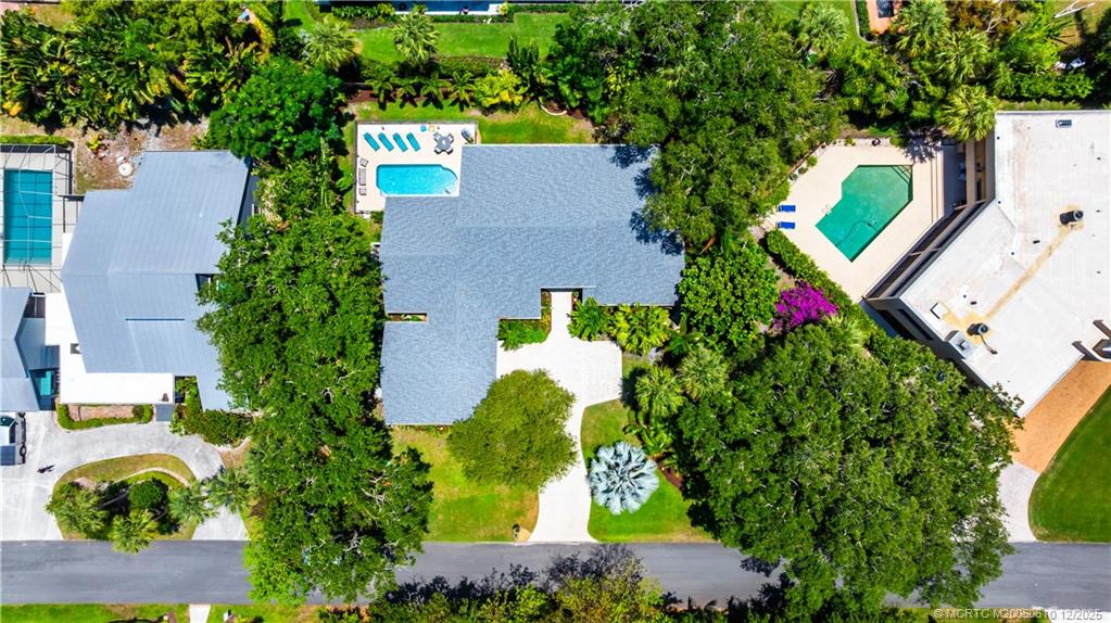 8 Kingston Court Stuart, FL 34996 - Photo 40 of 51 an aerial view of a house with a yard and a large tree