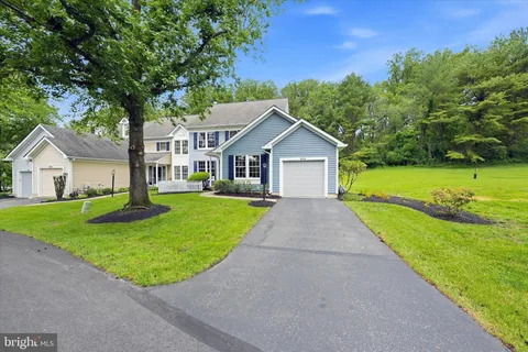 a front view of a house with yard