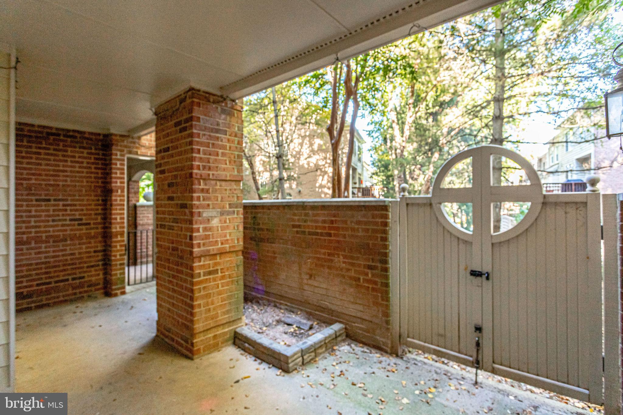 1357 Garden Wall Circle, Unit 708 Reston, VA 20194 - Photo 32 of 39 Patio backs to trees for privacy