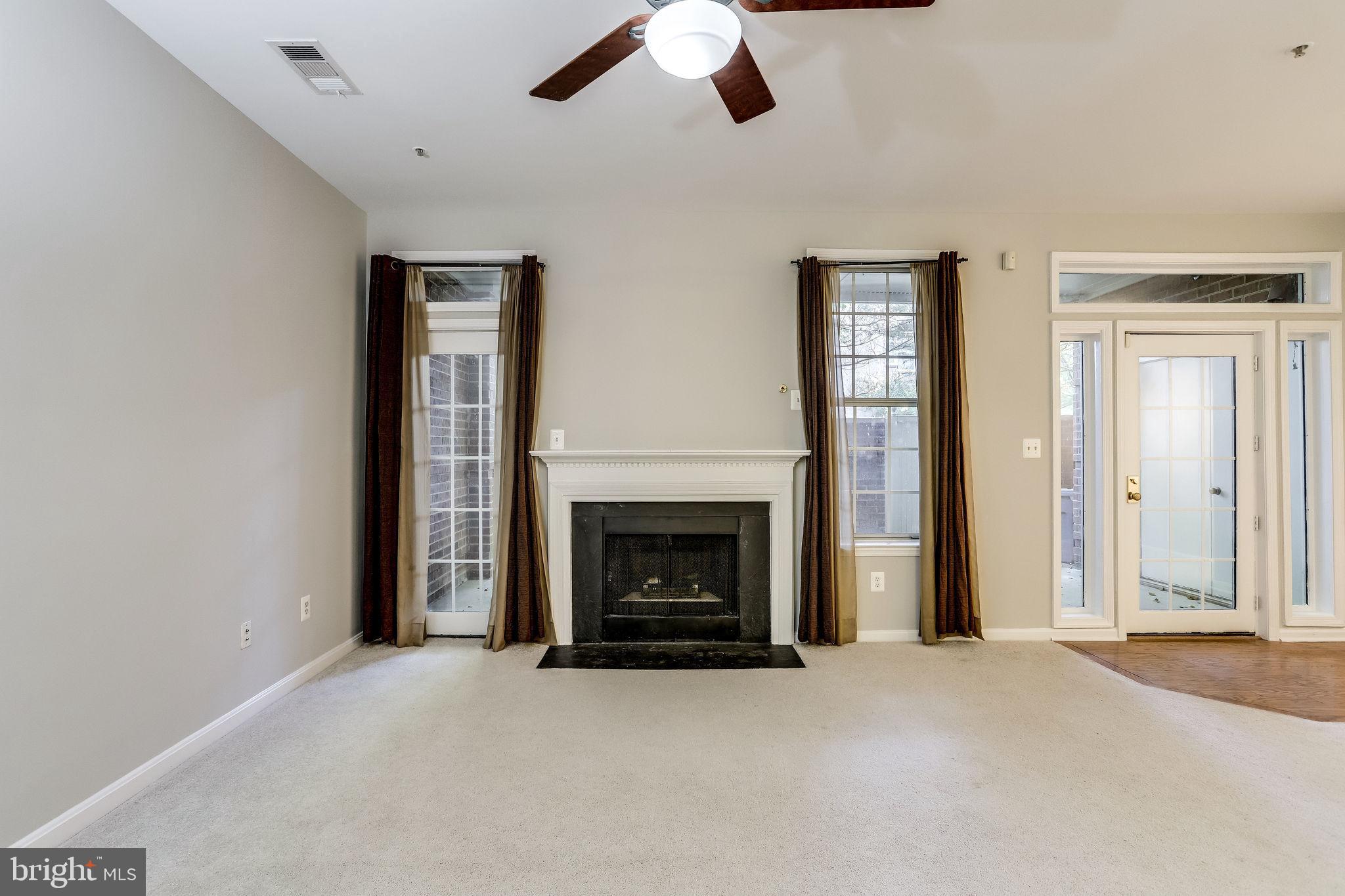 1357 Garden Wall Circle, Unit 708 Reston, VA 20194 - Photo 7 of 39 Cozy fireplace & Window bring in lots of light