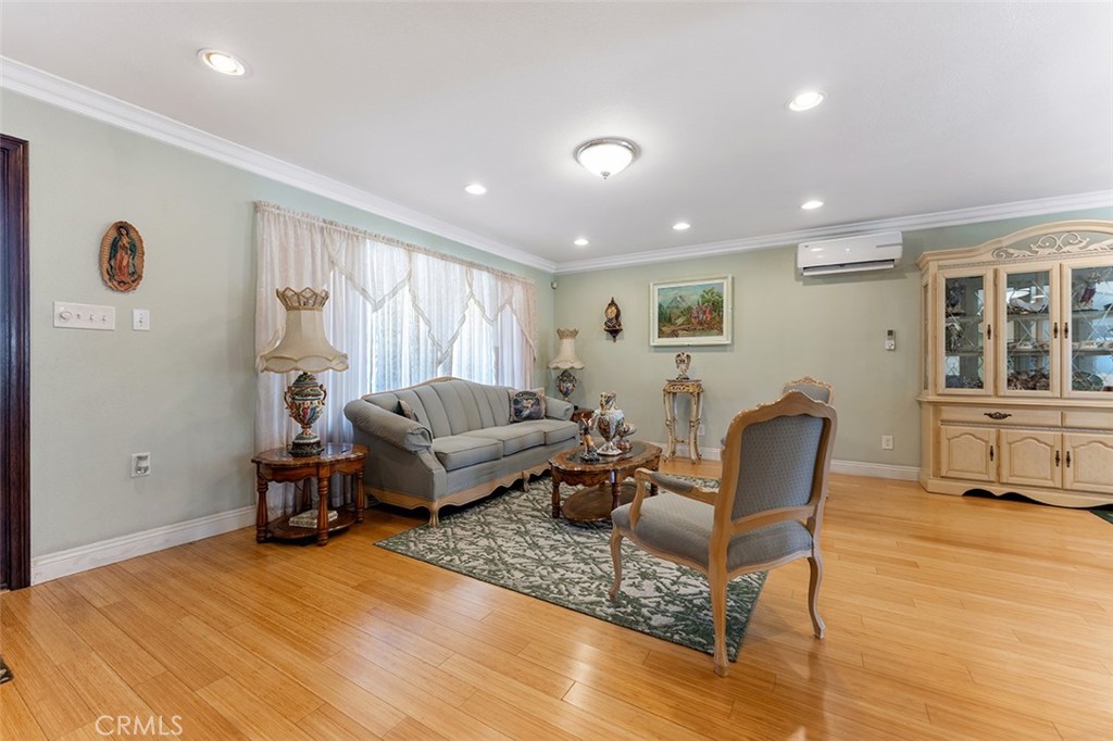 5441 North Calera Avenue Covina, CA 91722 - Photo 16 of 32 a living room with furniture and a wooden floor