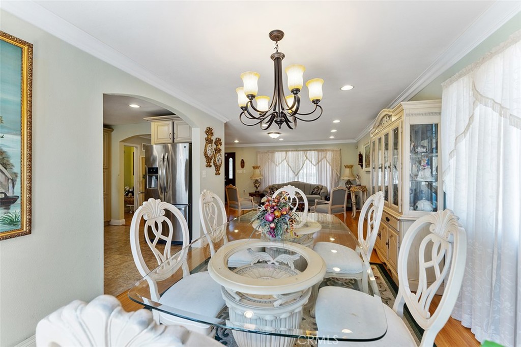 5441 North Calera Avenue Covina, CA 91722 - Photo 20 of 32 a view of a dining room with furniture a chandelier and wooden floor