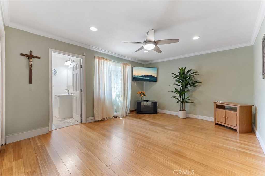 5441 North Calera Avenue Covina, CA 91722 - Photo 22 of 32 a view of an empty room with window and wooden floor