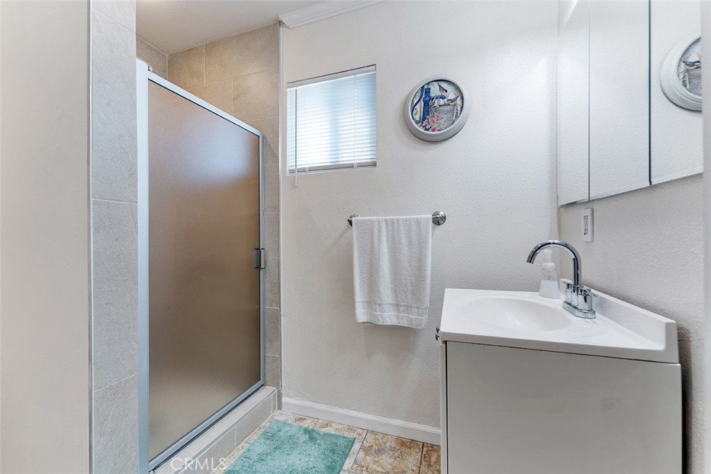 5441 North Calera Avenue Covina, CA 91722 - Photo 24 of 32 a bathroom with a sink and a mirror