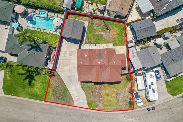 an aerial view of a house with a garden